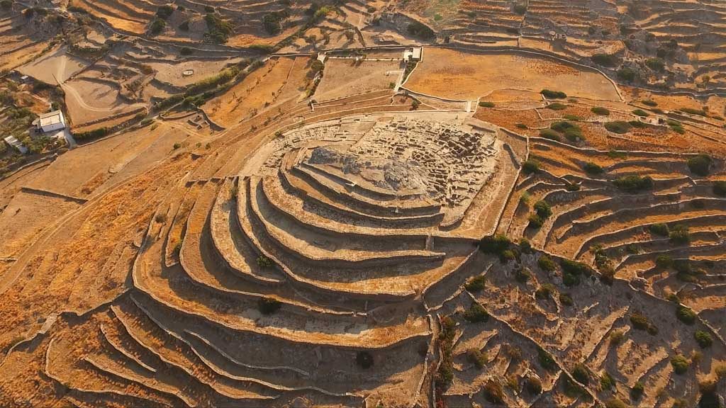 Aerial bird's eye photo of iconic prehistoric settlement of Skarkos, Ios island, Cyclades, Greece